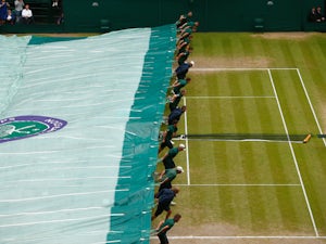 Play abandoned on outside courts at Wimbledon