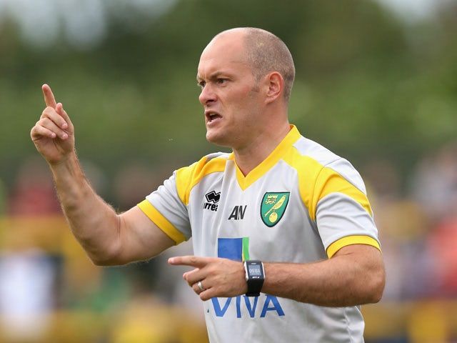 Alex Neil, the Norwich City manager, issues instructions during the pre season friendly match between Hitchin Town and Norwich City at Top Field Stadium on July 14, 2015