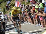 Great Britain's Chris Froome rides in the hill as supporters cheer during the 167 km tenth stage of the 102nd edition of the Tour de France cycling race on July 14, 2015