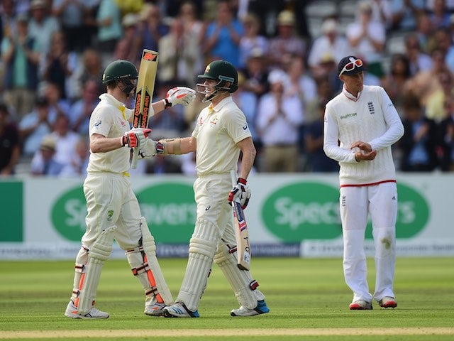 Chris Rogers of Australia celebrates his century with teammate Steven Smith during day one of the second Ashes Test at Lord's on July 16, 2015