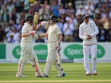 Chris Rogers of Australia celebrates his century with teammate Steven Smith during day one of the second Ashes Test at Lord's on July 16, 2015