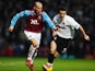 Freddie Ljungberg (L) of West Ham United is challenged by Simon Davies (R) of Fulham during the Barclays Premier League match between West Ham United and Fulham at Upton Park on January 12, 2008