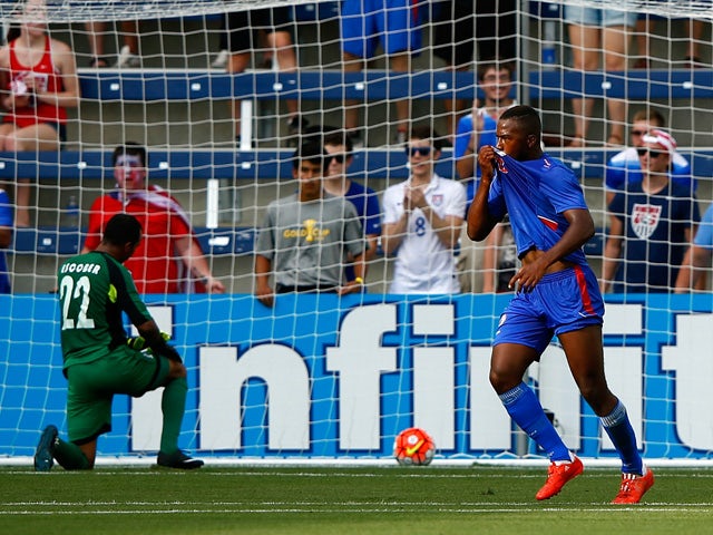 Nazon Duckens #20 of Haiti celebrates after scoring a goal against goalkeeper Donis Escober #22 of Honduras during the 2015 CONCACAF Gold Cup match at Sporting Park on July 13, 2015
