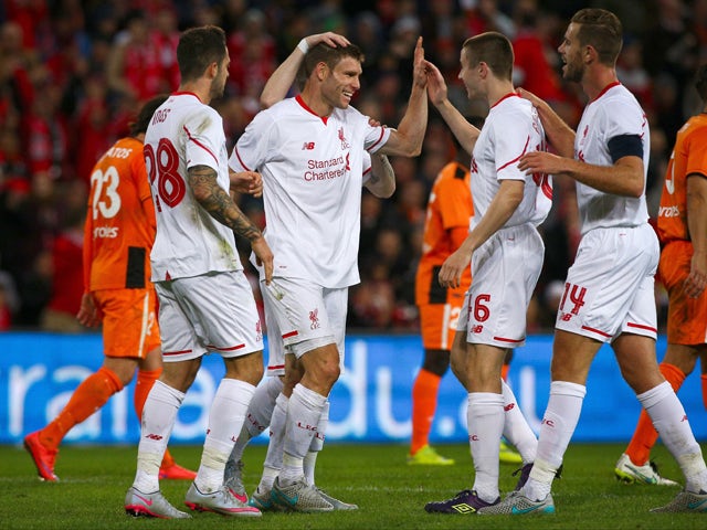 James Milner (C) of Liverpool celebrates his goal with teammates during the friendly football match between English Premier League side Liverpool and A-League side Brisbane Roar at Suncorp Stadium in Brisbane on July 17, 2015