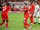 Mamadou Sakho of Liverpool (L) celebrates his goal during the international friendly match between Thai Premier League All Stars and Liverpool FC at Rajamangala Stadium on July 14, 2015