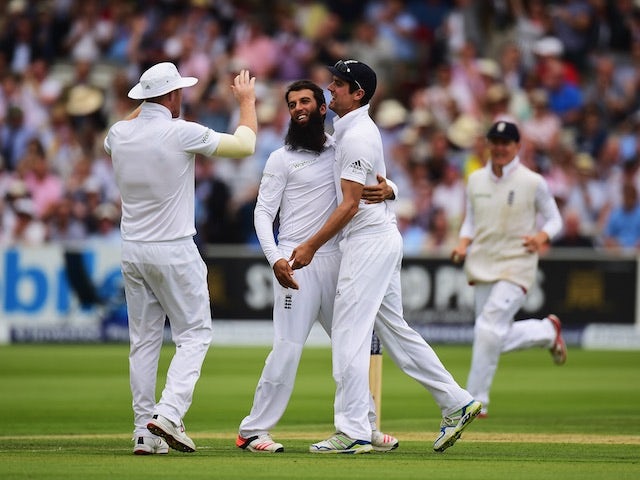 England celebrate after Moeen Ali took the first wicket of the second Ashes Test against Australia at Lord's on July 16, 2015