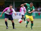 Louis Thompson of Norwich City moves away with the ball during the pre season friendly match between Hitchin Town and Norwich City at Top Field Stadium on July 14, 2015