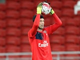 New signing Petr Cech (C) of Arsenal warms up during the Arsenal FC open training ahead of the match between Arsenal and Singapore during the 2015 Barclays Asia Trophy Tournament at the Sports Hub National Stadium on July 14, 2015