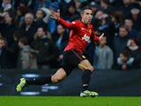 Manchester United's Dutch striker Robin Van Persie celebrates scoring his late winning goal in the English Premier League football match between Manchester City and Manchester United at The Etihad stadium in Manchester, north-west England on December 9, 2