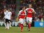 Arsenal players celebrate their second goal scored by Santi Cazorla during the Barclays Asia Trophy match between Arsenal and Everton at the National Stadium on July 18, 2015