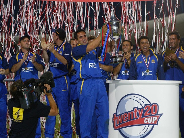 Adam Hollioake, the Surrey captain, and the rest of the team celebrate with the trophy after the Surrey v Warwickshire Final of the Twenty20 competition at Trent Bridge on July 19, 2003