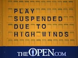 A sign at St Andrews signals the suspension of play in The Open