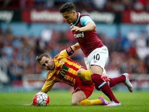 Mauro Zarate of West Ham is challenged by Paul French of FC Birkirkara during the UEFA Europa League second qualifying round (first leg) match between West Ham and FC Birkirkara at the Boleyn Ground on July 16, 2015