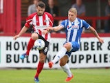 Simon Richman of Altrincham tangles with Martyn Waghorn of Wigan Athletic during the pre season friendly between Altrincham and Wigan Athletic at the J Davidson stadium on July 14, 2015