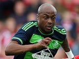 Andre Ayew of Swansea City controls the ball from Jack Hobbs of Nottingham Forest during the pre season friendly match between Nottingham Forest and Swansea City at City Ground on July 25, 2015