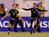 Andres Guardado #18 of Mexico celebrates his goal with teammate Jonathan do Santos #8 in the final minute of overtime against Costa Rica during the quarterfinals of the 2015 CONCACAF Gold Cup at MetLife Stadium on July 19, 2015