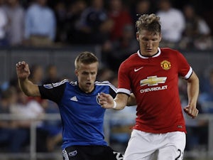 Bastian Schweinsteiger #23 of Manchester United dribbles the ball as Tommy Thompson #22 of San Jose Earthquakes defends during the second half of their International Champions Cup match on July 21, 2015