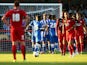 Brighton celebrate with Dale Stephens of Brighton after he scores to make it 1-0 during the Pre Season Friendly between Crawley Town and Brighton & Hove Albion at the Checkatrade.com Stadium on July 22, 2015