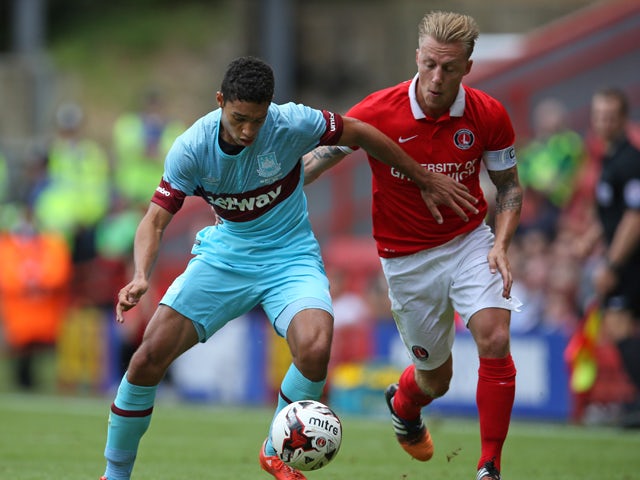 Kyle Knoyle of West Ham United holds off the challenge of Chris Solly of Charlton Athletic during the pre season friendly match between Charlton Athletic and West Ham United at the Valley on July 25, 2015