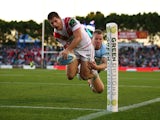Charly Runciman of the Dragons dives to score during the round 18 NRL match between the Cronulla Sharks and the St George Illawarra Dragons at Remondis Stadium on July 12, 2015