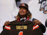 Danny Shelton of the Washington Huskies holds up a jersey after being picked #12 overall by the Cleveland Browns during the first round of the 2015 NFL Draft at the Auditorium Theatre of Roosevelt University on April 30, 2015 