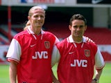Emmanuel Petit and Marc Overmars sign for Arsenal at Highbury in London on August 1, 1997
