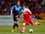 Johann Gudmundsson of Charlton and Dan Gosling of Bournemouth during the Sky Bet Championship match between Charlton Athletic and AFC Bournemouth at The Valley on May 2, 2015