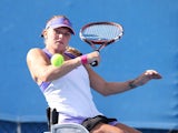 Jordanne Whiley of Great Britain in action in their match with Yui Kamiji of Japan against Sharon Walraven of the Netherlands and Katharina Kruger of Germany during the Australian Open 2015 Wheelchair Championships at Melbourne Park on January 29, 2015