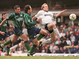 Tottenham Hotspurs star German striker Jurgen Klinsmann is in full flight as he lunges for the ball during his last match for Spurs against Leeds United 14 May, 1995