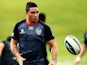 Kevin Locke of the Warriors passes the ball during a New Zealand Warriors NRL training session at Mt Smart Stadium on May 21, 2014