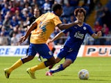 Shinji Okazak of Leicester City is challenged by Krystian Pearce of Mansfield Town during the pre season friendly match between Mansfield Town and Leicester City at the One Call Stadium on July 25, 2015