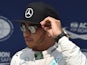 Mercedes AMG Petronas F1 Team's British driver Lewis Hamilton reacts after the qualifying race at the Hungaroring racetrack in Mogyorod, Hungary,on July 25, 2015