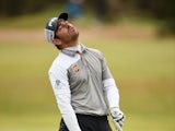 Louis Oosthuizen of South Africa reacts to his approach shot on the 17th hole in the playoff during the final round of the 144th Open Championship at The Old Course on July 20, 2015