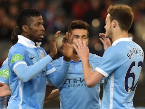 Kelechi Iheanacho of Manchester City is congratulated by teammates after scoring a goal at the International Champions Cup football match between English Premier League team Manchester City and Italian side AS Roma in Melbourne on July 21, 2015
