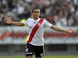 River Plate's midfielder Manuel Lanzini celebrates after scoring the team's second goal against Independiente during their Argentine First Division football match, at the Monumental stadium in Buenos Aires, Argentina, on June 9, 2013