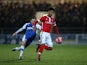 Mason Holgate of Barnsley clears the ball from Craig Mahon of Chester during the FA Cup Second Round Replay match between Chester City and Barnsley at Deva Stadium on December 16, 2014