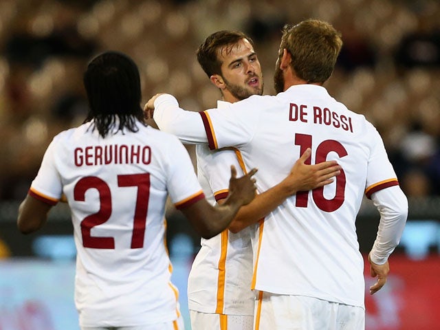 Miralem Pjanic of AS Roma celebrates with team-mates after scoring a goal during the International Champions Cup friendly match between Manchester City and AS Roma at the Melbourne Cricket Ground on July 21, 2015