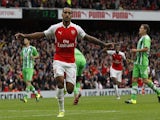 Arsenal's English midfielder Theo Walcott celebrates scoring the opening goal of the pre-season friendly football match between Arsenal and Wolfsburg at The Emirates Stadium in north London on July 26, 2015