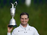 Zach Johnson holds the Claret Jug aloft after winning The Open at St Andrews on July 20, 2015