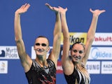 Russia's mixed duet Aleksandr Maltsev and Darina Valitova waves after the Mixed duet Free final event during the synchronised swimming competition at the 2015 FINA World Championships in Kazan on July 30, 2015