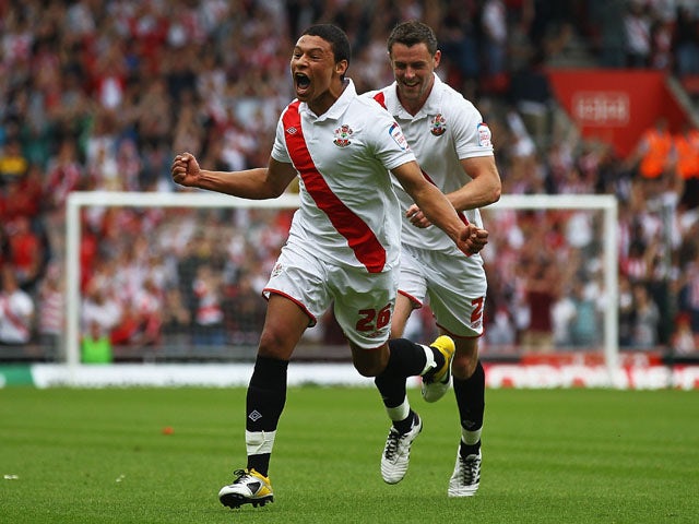 Alex Chamberlain of Southampton celebrates his goal with team mate Frazer Richardson during the npower League One match between Southampton and Walsall at St Mary's Stadium on May 7, 2011