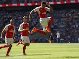 Arsenal's English midfielder Alex Oxlade-Chamberlain celebrates scoring the opening goal of the FA Community Shield football match between Arsenal and Chelsea at Wembley Stadium in north London on August 2, 2015