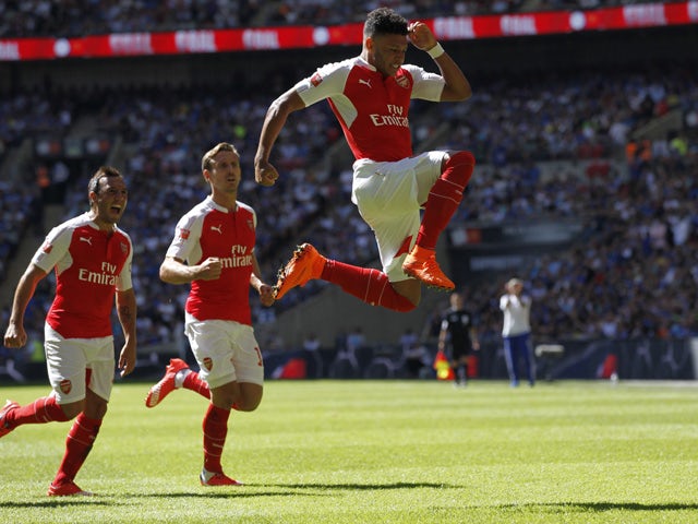 Arsenal's English midfielder Alex Oxlade-Chamberlain celebrates scoring the opening goal of the FA Community Shield football match between Arsenal and Chelsea at Wembley Stadium in north London on August 2, 2015