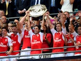 Captain Mikel Arteta of Arsenal lifts the trophy after their 1-0 win in the FA Community Shield match between Chelsea and Arsenal at Wembley Stadium on August 2, 2015