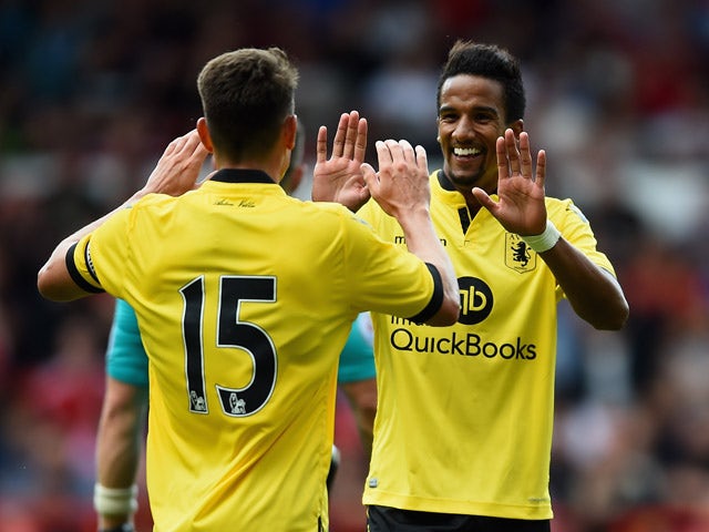 Scott Sinclair of Aston Villa is congratulated on scoring the third goal during the Pre Season Friendly match between Nottingham Forest and Aston Villa at City Ground on August 1, 2015