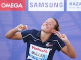 Gold medallist Aurelie Muller of France celebrates during the medal ceremony for the Women's 10km Open Water Swimming Final on day four of the 16th FINA World Championships at the Kazanka River on July 28, 2015