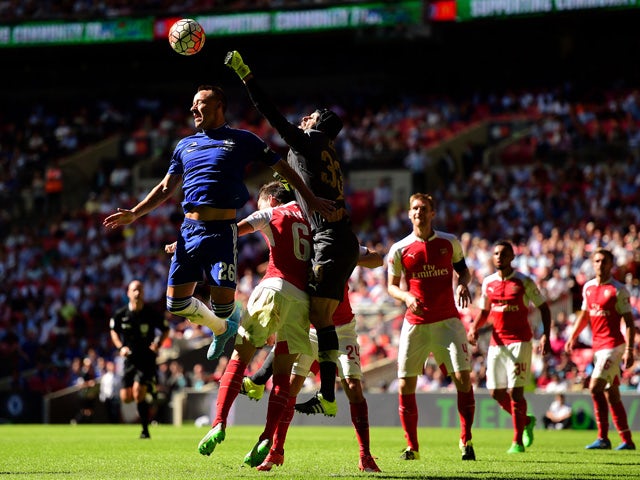 John Terry of Chelsea and Petr Cech of Arsenal compete for the ball during the FA Community Shield match between Chelsea and Arsenal at Wembley Stadium on August 2, 2015
