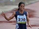 Dutee Chand waves to the crowd after their race on the fifth and the final day of the Asian Athletics Championship 2013 at the Chatrapati Shivaji Stadium in Pune on July 7, 2013