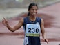Dutee Chand waves to the crowd after their race on the fifth and the final day of the Asian Athletics Championship 2013 at the Chatrapati Shivaji Stadium in Pune on July 7, 2013