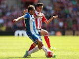Victor Sanchez of Espanyol holds off pressure from Juanmi of Southampton during the pre season friendly match between Southampton and Espanyol at St Mary's Stadium on August 2, 2015